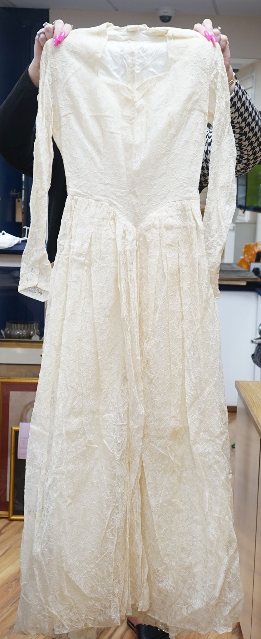 A late 1930's- 40's cream machine lace wedding dress and petticoat together with a pear listed floral tiara/ headdress.